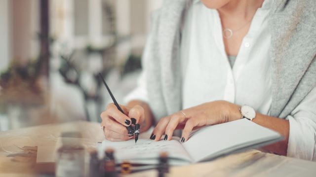 Caligraphy pen and notepad